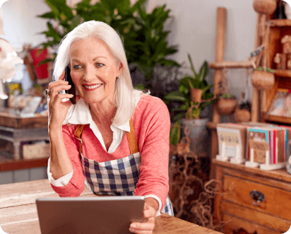 Lady In Apron On Phone