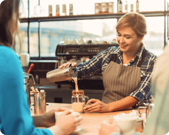 lady making a latte for a customer