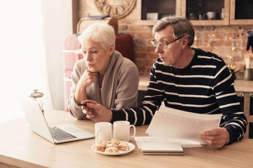 older couple dealing with bills.