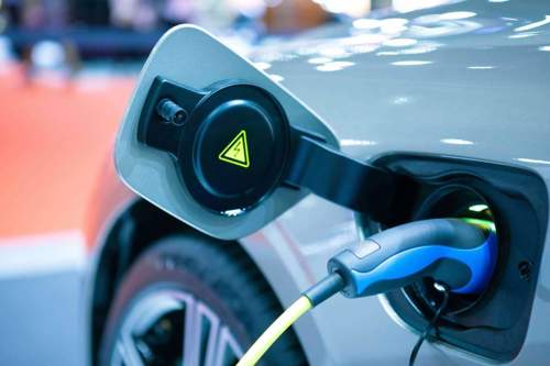 An electric vehicle plugged into a charging station.