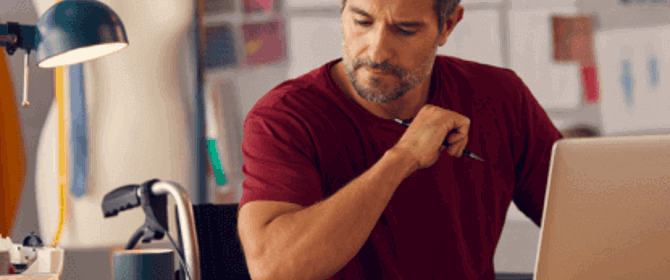 Tailor Sat At Desk