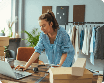 Lady packing boxes for store