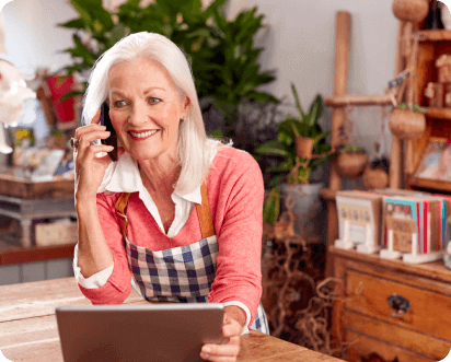 lady-in-apron-on-phone.webp